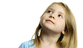A young girl with autism looking up.
